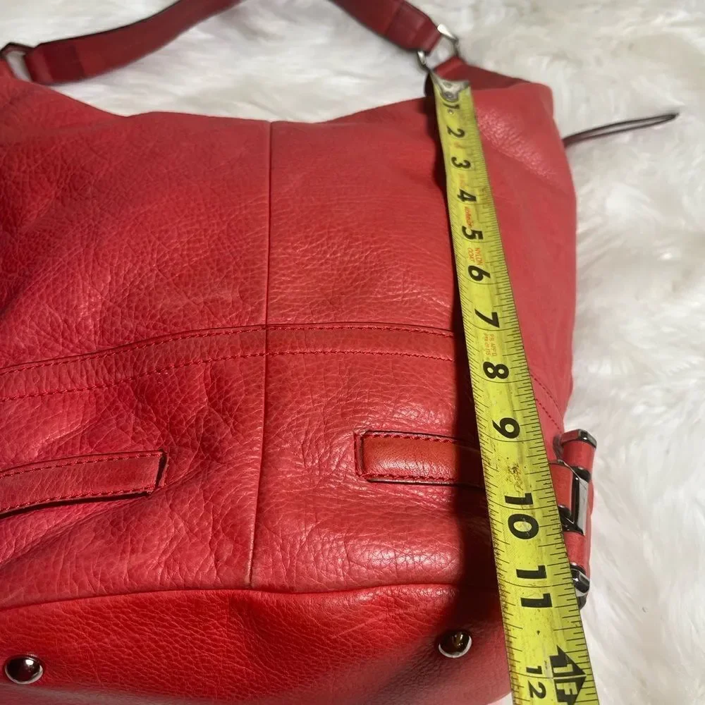 B Makowsky leather orange Hobo bucket style shoulder bag  silver tone hardwares